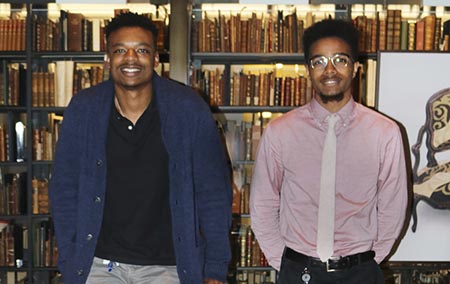Two interns from New haven Promise program working at Beinecke Library