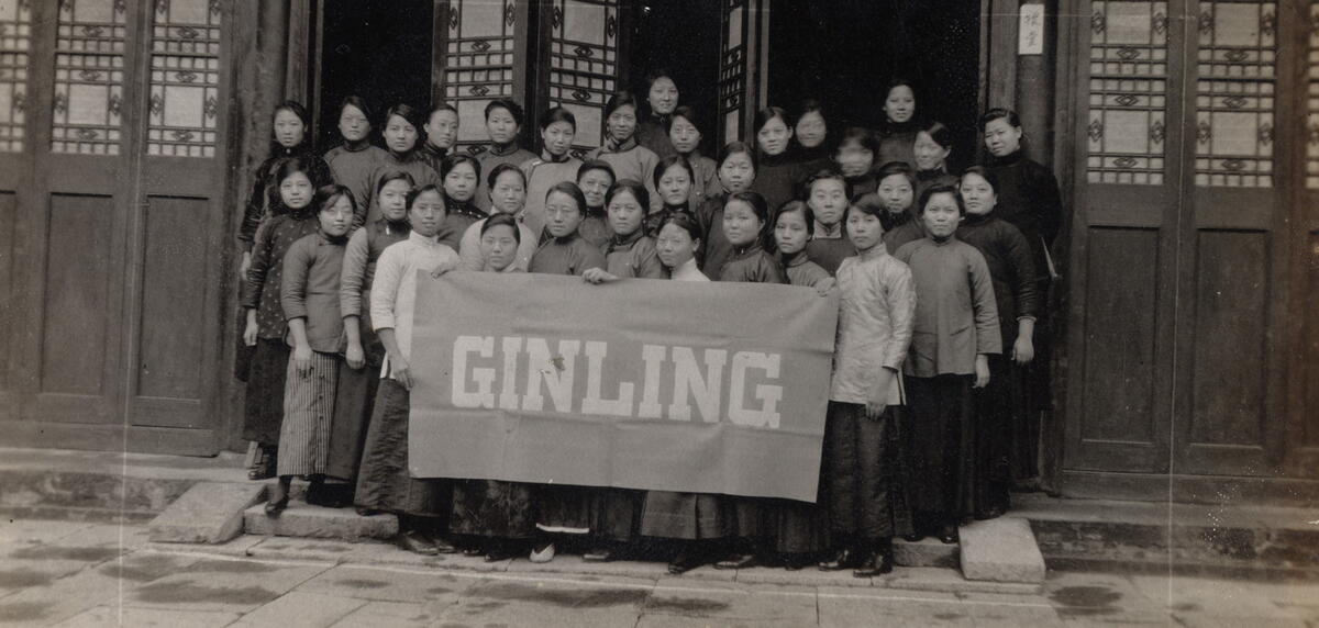 Ginling students holding the college banner