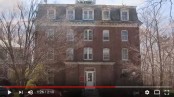 A tall red brick buildingDescription generated with very high confidence
