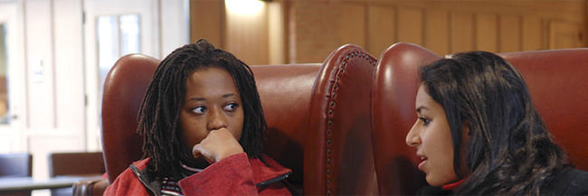 Students conversing in the Anne T. and Robert M. Bass Library