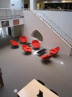 Basement level of the Robert B. Haas Family Arts Library with chairs designed by Eero Saarinen