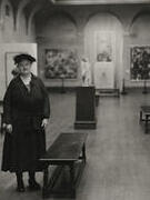 Woman standing in art gallery