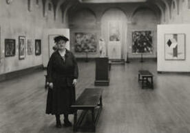 Woman standing in art gallery