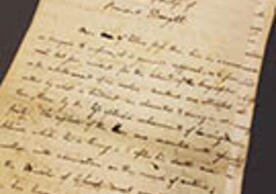 Paper at angle with handwritten text