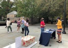 Students wait in line to write postcards for the University archives