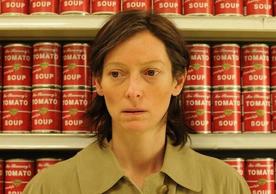 film still showing a close-up of Tilda Swinton in a grocery store