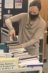 University Librarian Barbara Rockenbach scans books