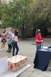 Students wait in line to write postcards for the University archives