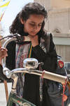 Young actress looks at a bicycle in the film Wadjda.