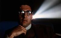 John Turturro sits in a theater watching a film in Barton Fink